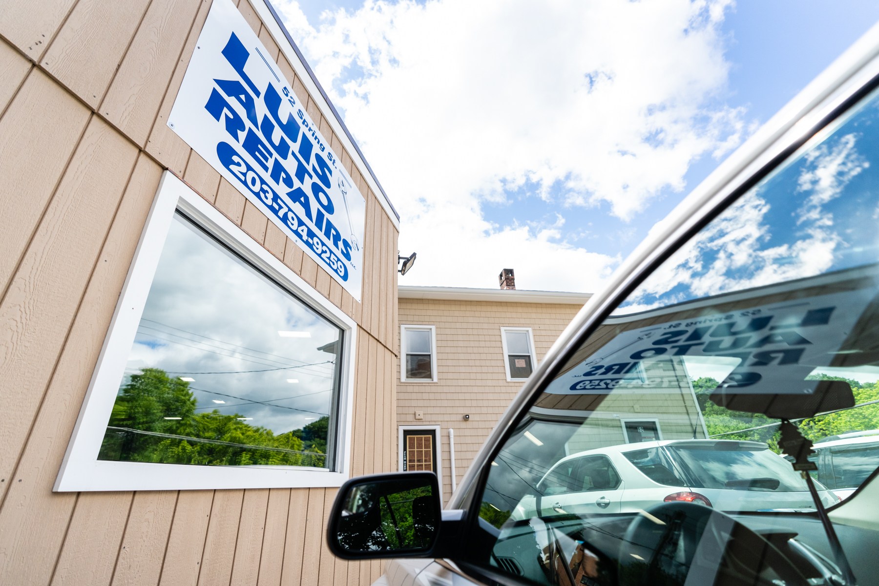 Luis Auto Repairs sign and service entrance at 52 Spring St
